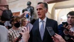 Mitt Romney is questioned by the reporters